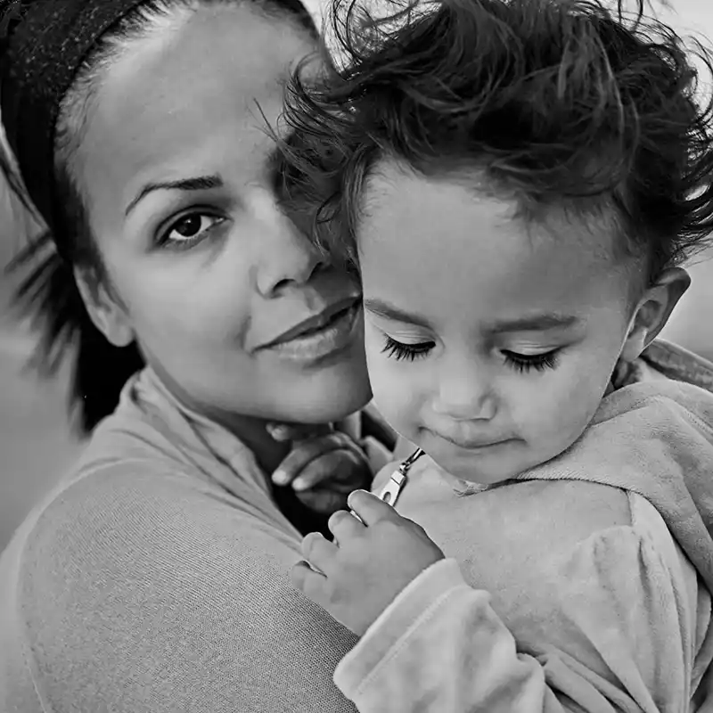 Young mother holding child