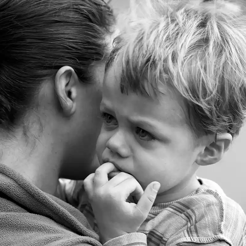 Young child in Mom's arms